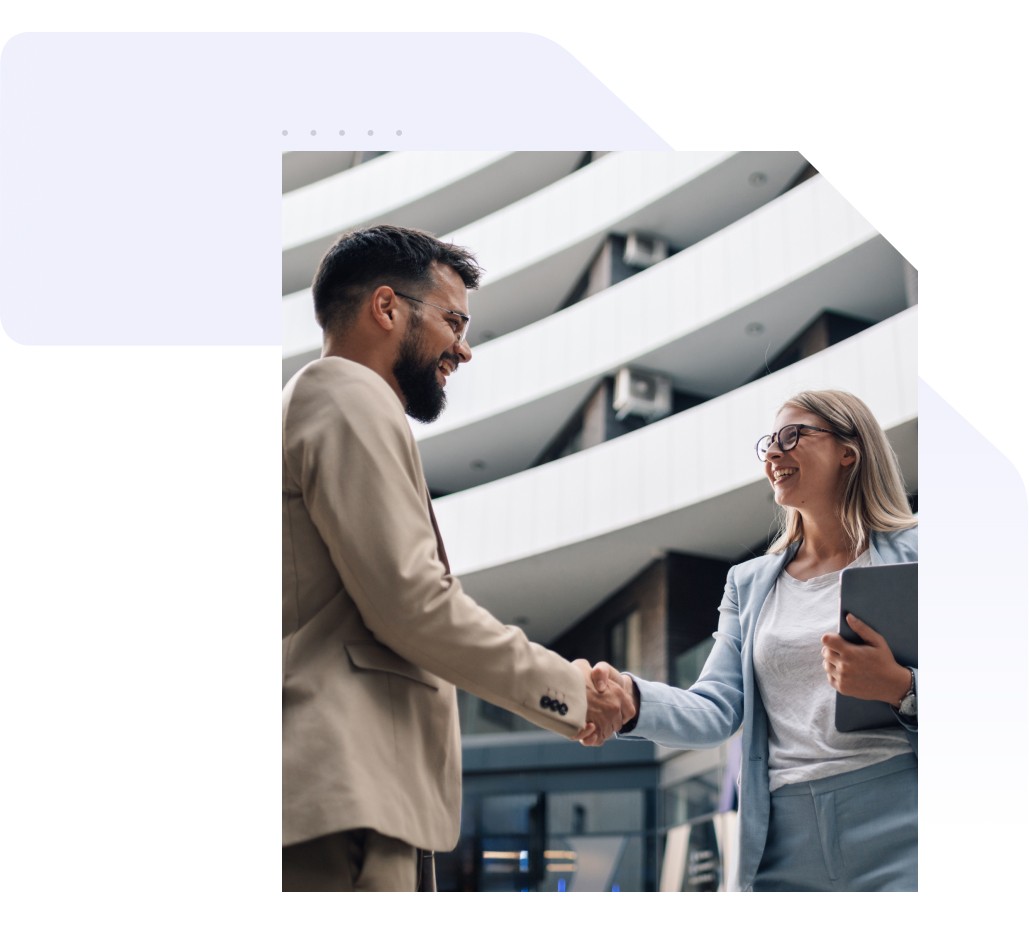 Two professionals shaking hands after a Tosa partnership meeting